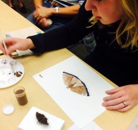 Painting a mourning cloak butterfly at Nancy Seiler's Sip & Sketch program at the Montana Natural History Center