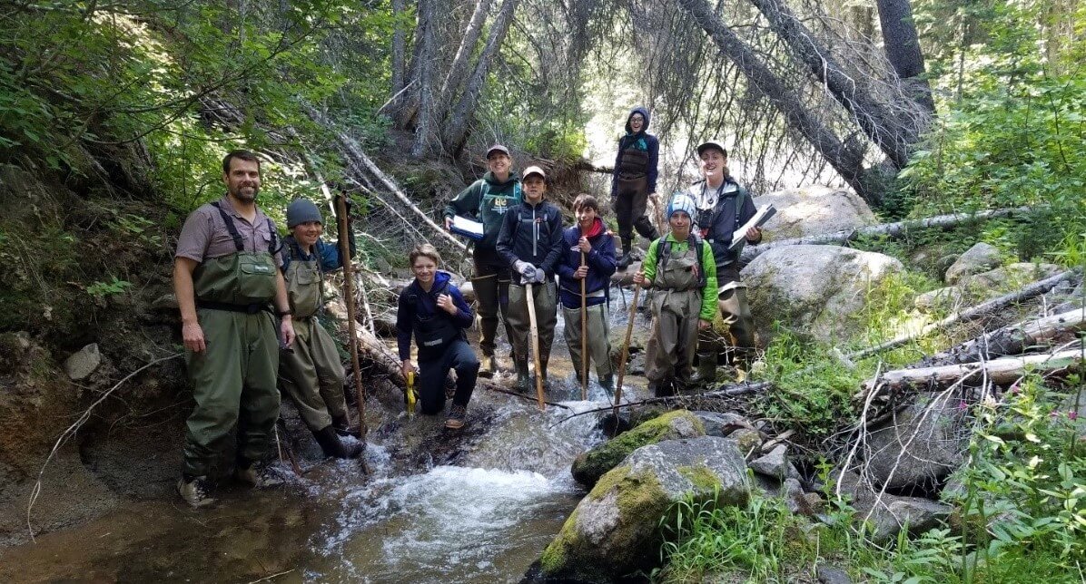 young citizen scientists exploring Lolo Creek for beaver sign