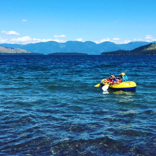 kids in a boat on Flathead Lake