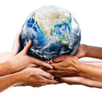 image of many hands, of all different shades, holding the planet Earth