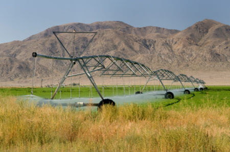 center-pivot irrigation system with mountains in the background